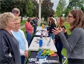 Community members and City staff talk at City Chats in the Parks.