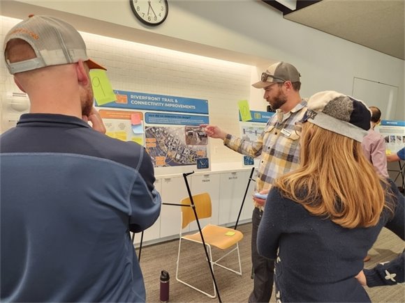 City staff explains project details to community members. 